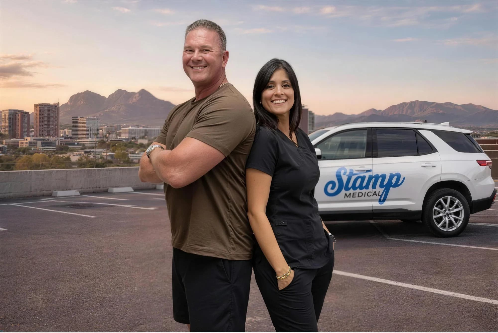 The family owners of Stamp Medical standing beside a branded clinic vehicle in Phoenix, Arizona